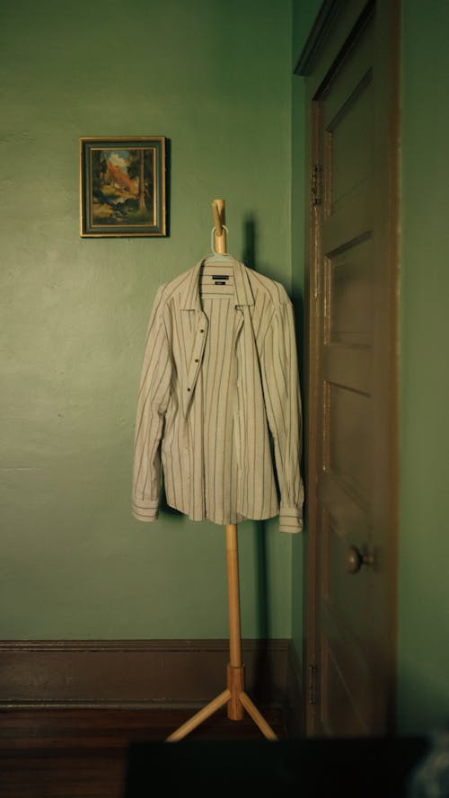 A shirt on a clothes rack in a room