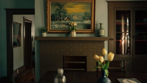 A painting is on the wall in a dining room