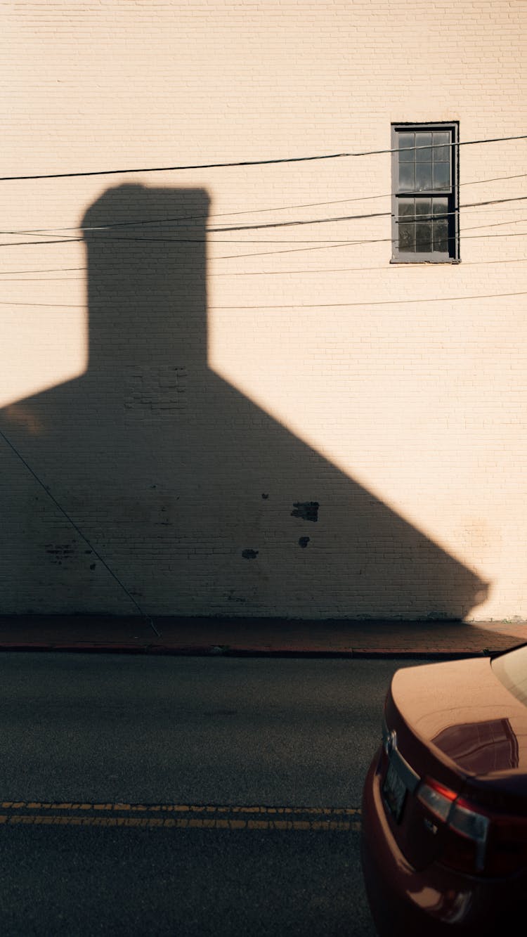 Shadow Of A House On A Wall