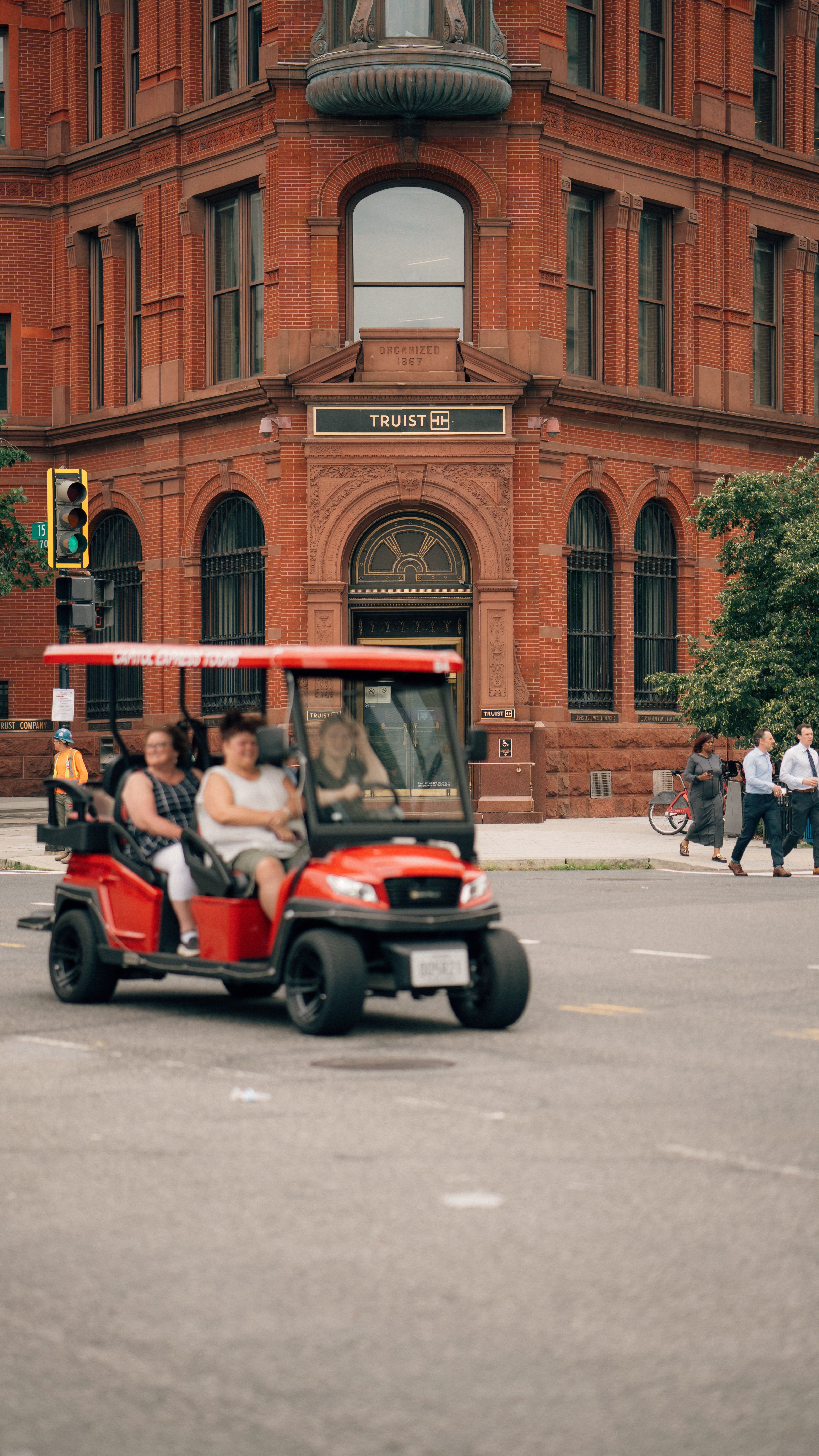 View of a Cart Driving on the Street in a City · Free Stock Photo