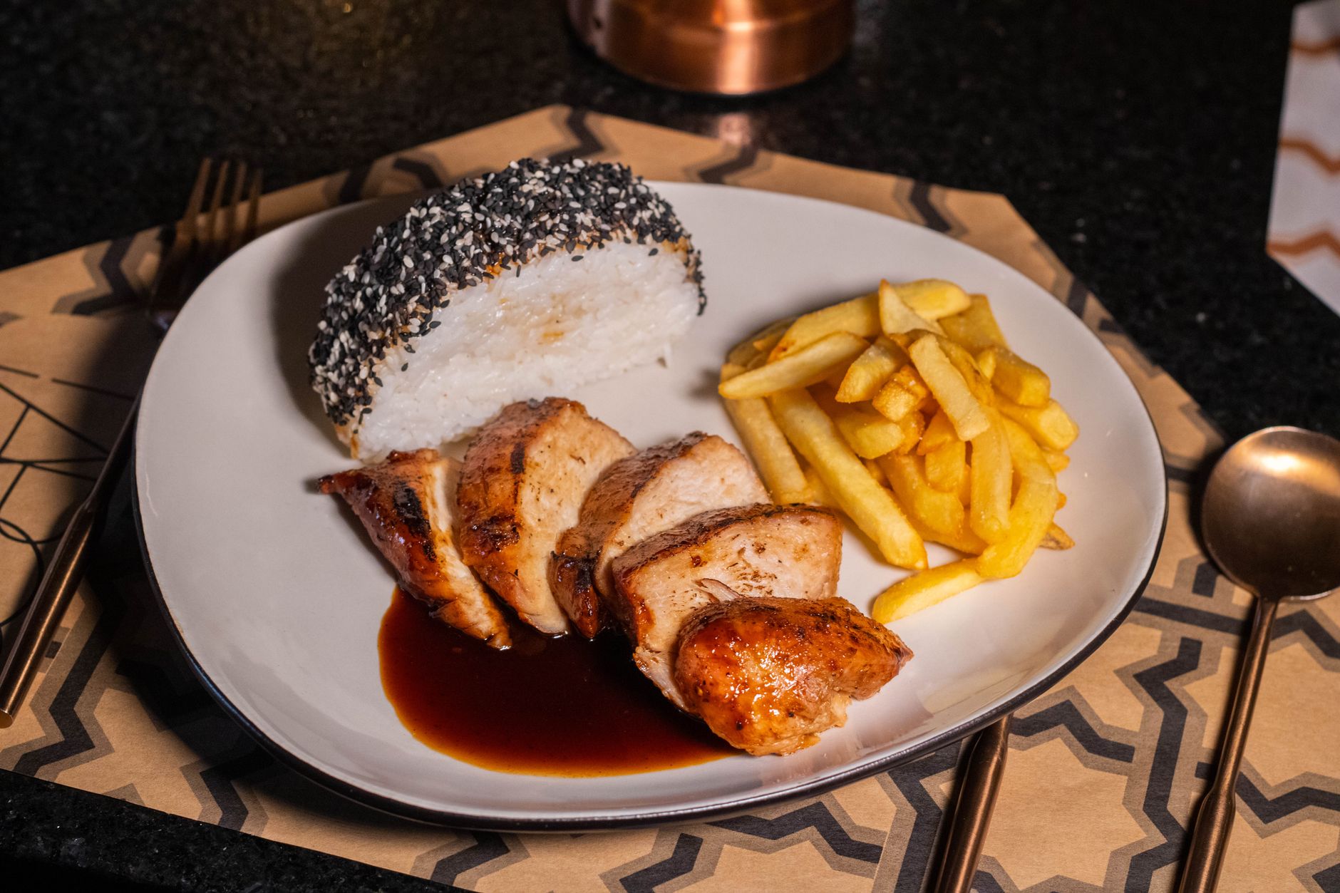 Juicy baked chicken breast with a golden crust served alongside fluffy white rice