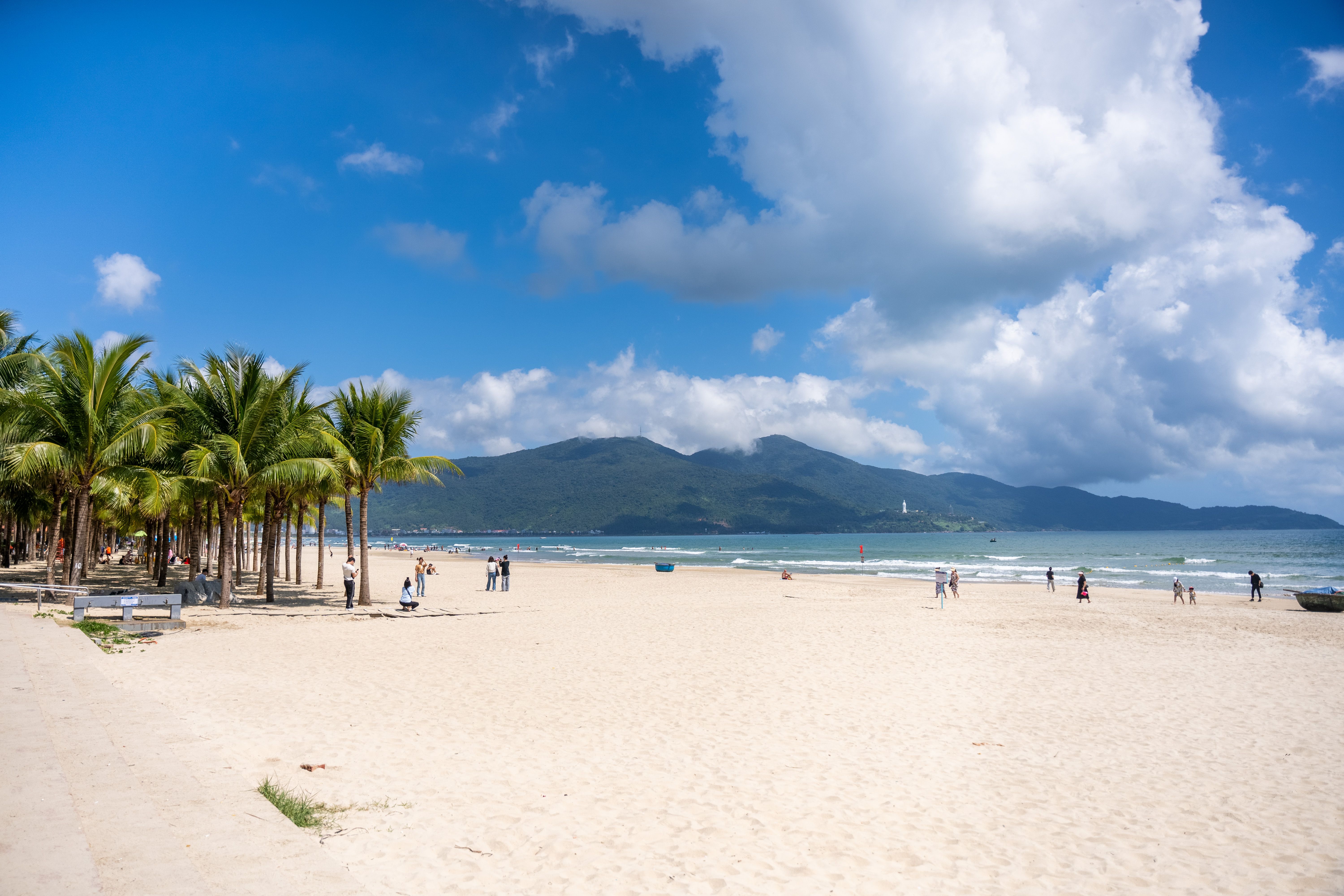 An Bang Beach with palm trees and a few people relaxing