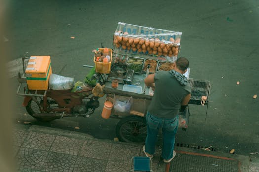 A street vendor prepares food at a mobile stall in Ho Chi Minh City, Vietnam.