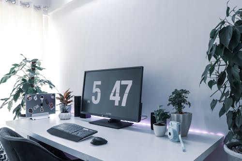 Free stock photo of camera, computer keyboard, desk