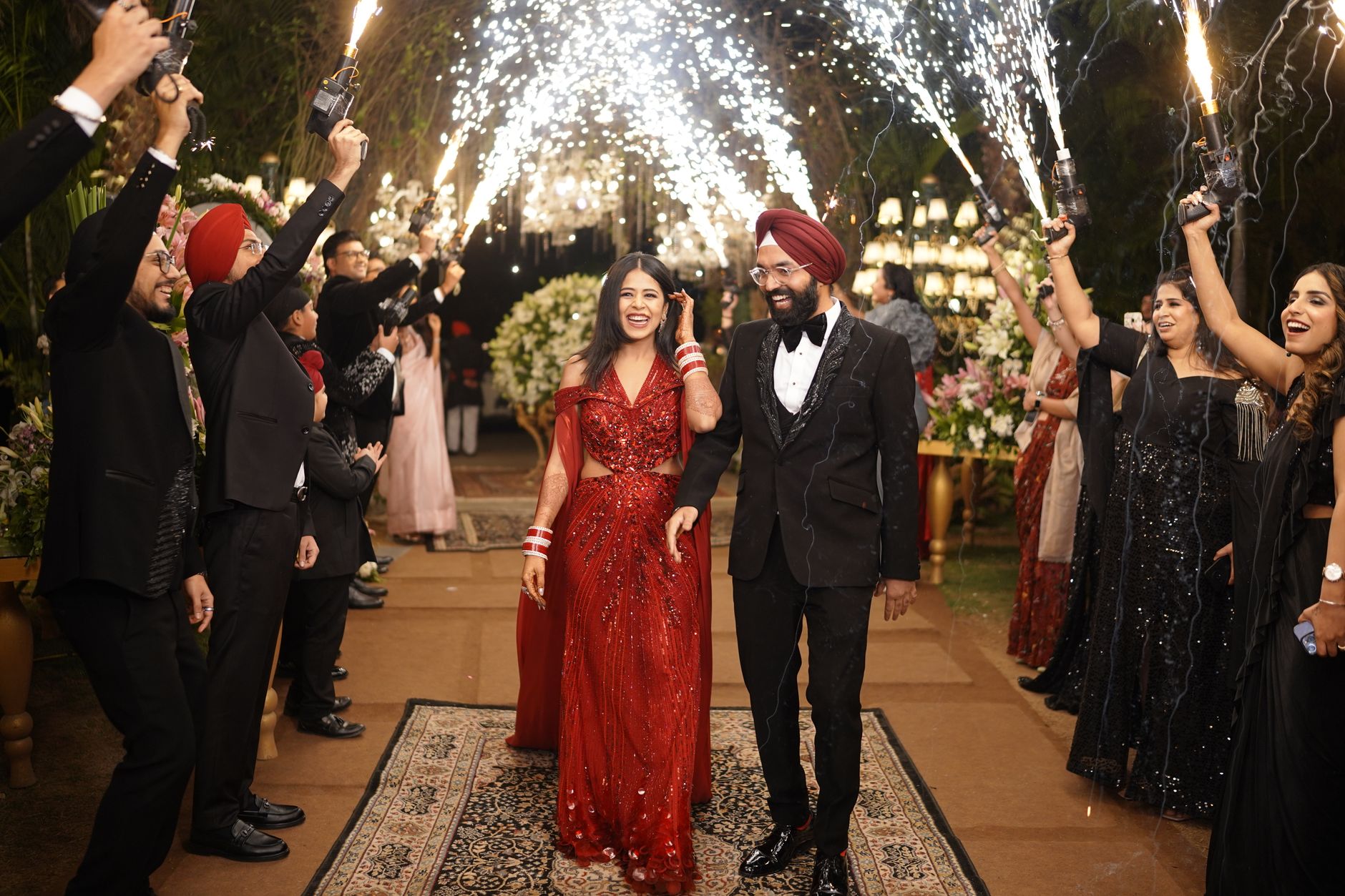 Chandigarh wedding celebration with bride and groom under sparkling fireworks.