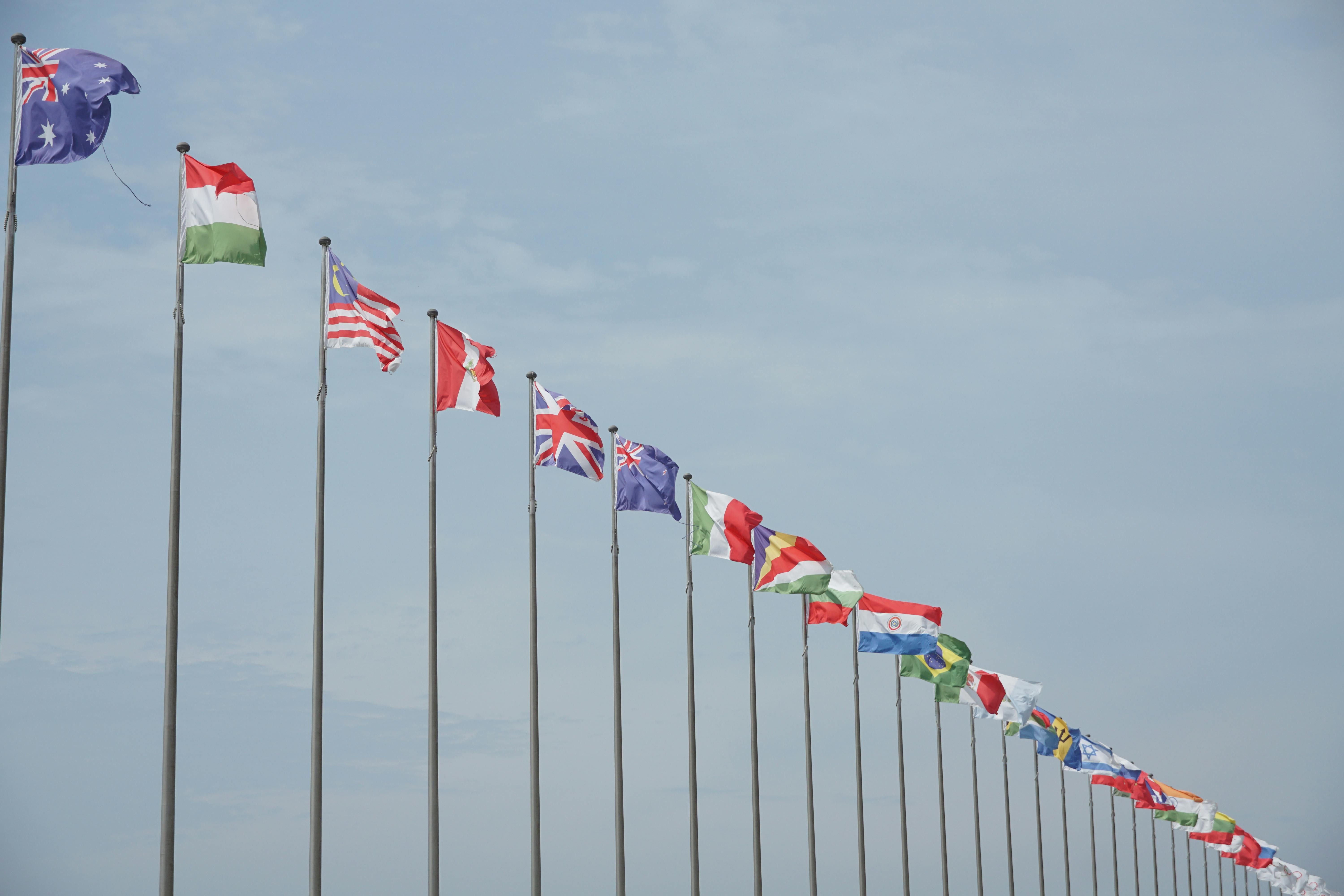 https://www.pexels.com/photo/flagpoles-in-line-with-different-national-flags-26560423/