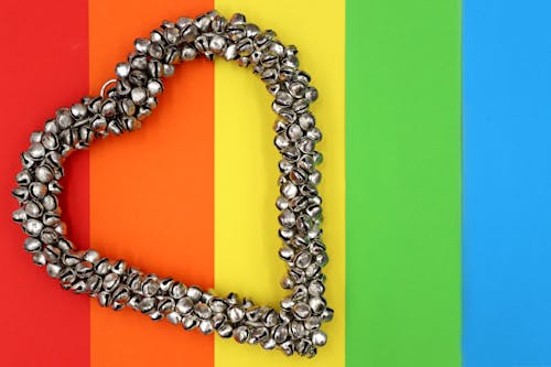 Metal Bell Heart on Top of Colored Background