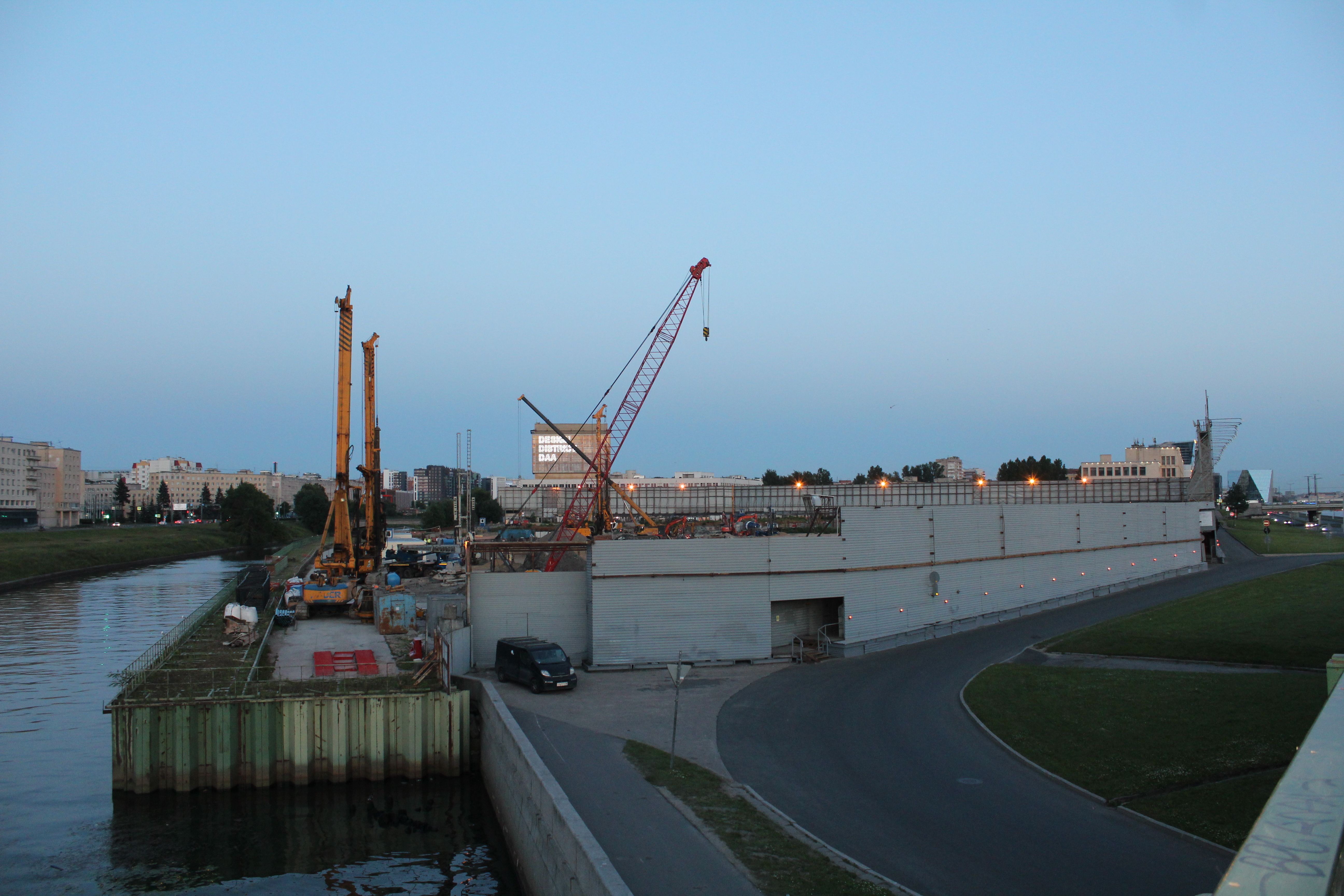 Construction Cranes and Buildings around River in City · Free Stock Photo