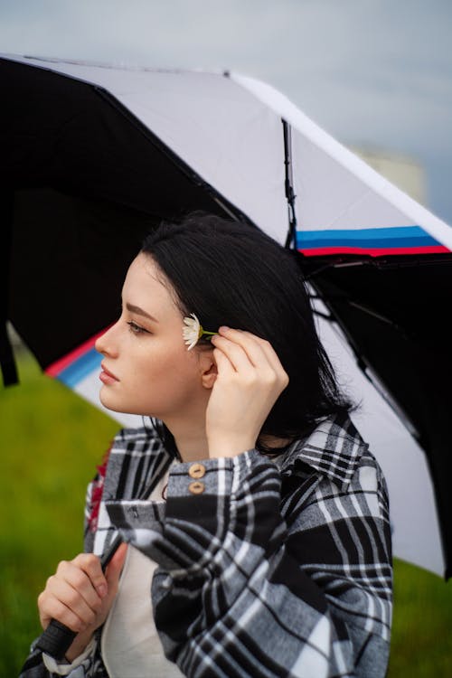 A woman with an umbrella in the rain