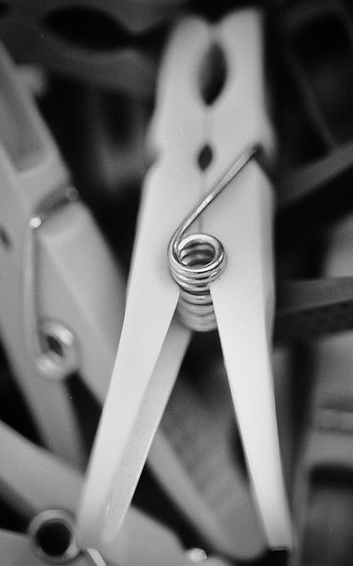 A black and white photo of clothespins