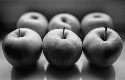 Free Artistic black and white capture of apples in a classic still life arrangement. Stock Photo