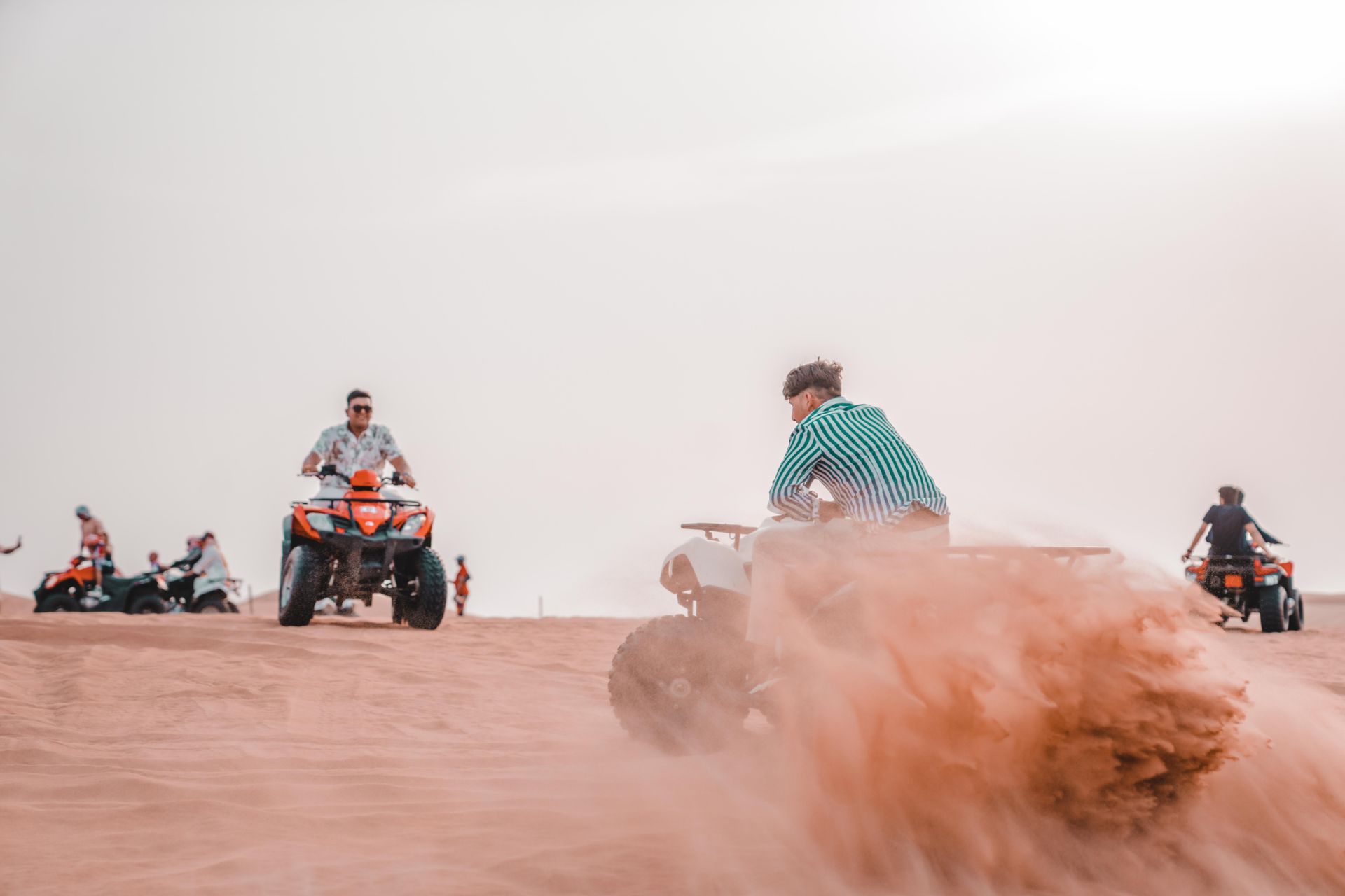 Experience the excitement of quad biking across sandy desert dunes in a thrilling outdoor adventure.