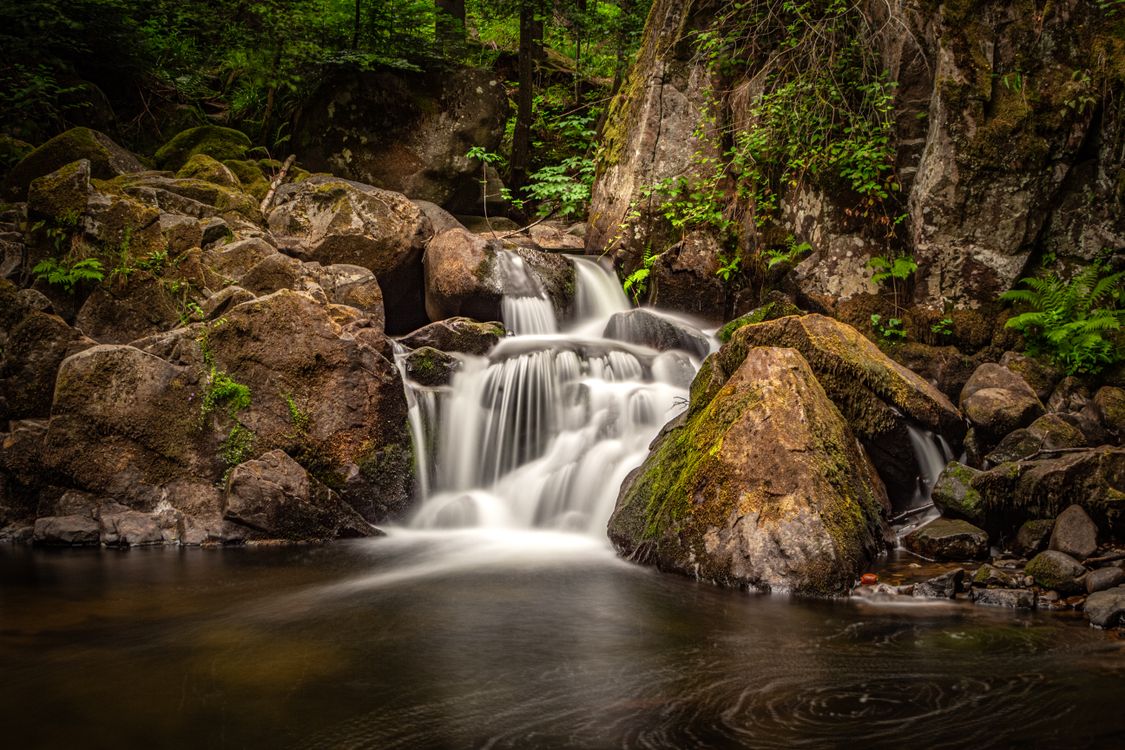 Cascaded Rocks Cascade on Rocks in Woods · Free Stock Photo