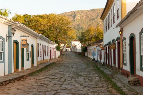 Free Scenic view of a cobblestone street lined with colorful colonial buildings in Paraty, Brazil. Stock Photo