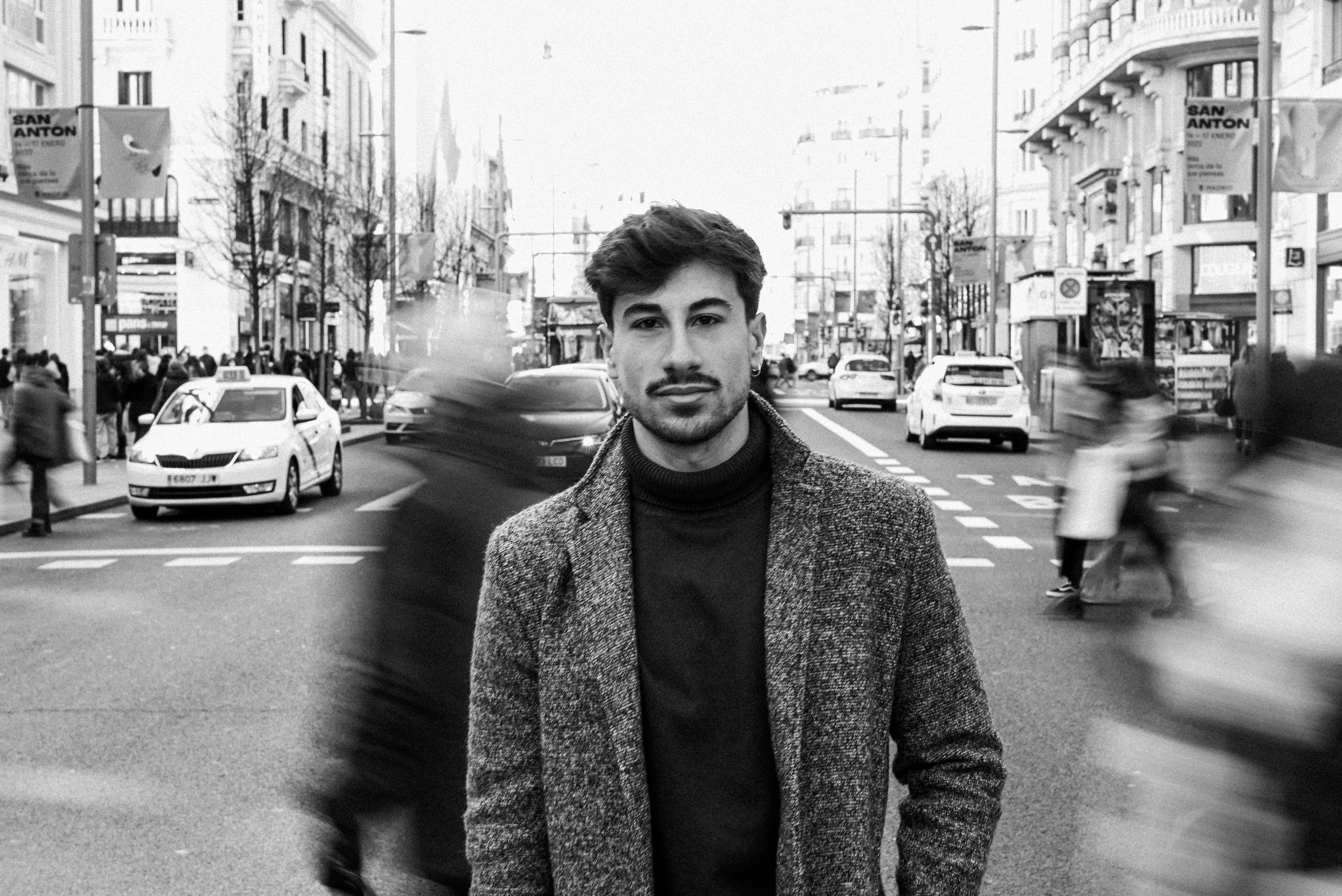 Man Walking on a Street in Black and White · Free Stock Photo