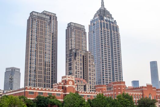 View of elegant skyscrapers against a clear sky, showcasing urban architecture.
