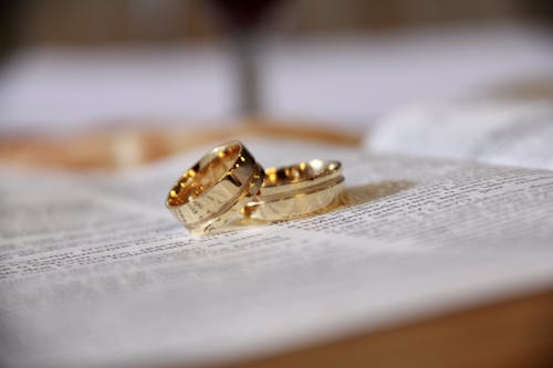 Macro Shot Photography of Two Gold-colored Band Rings