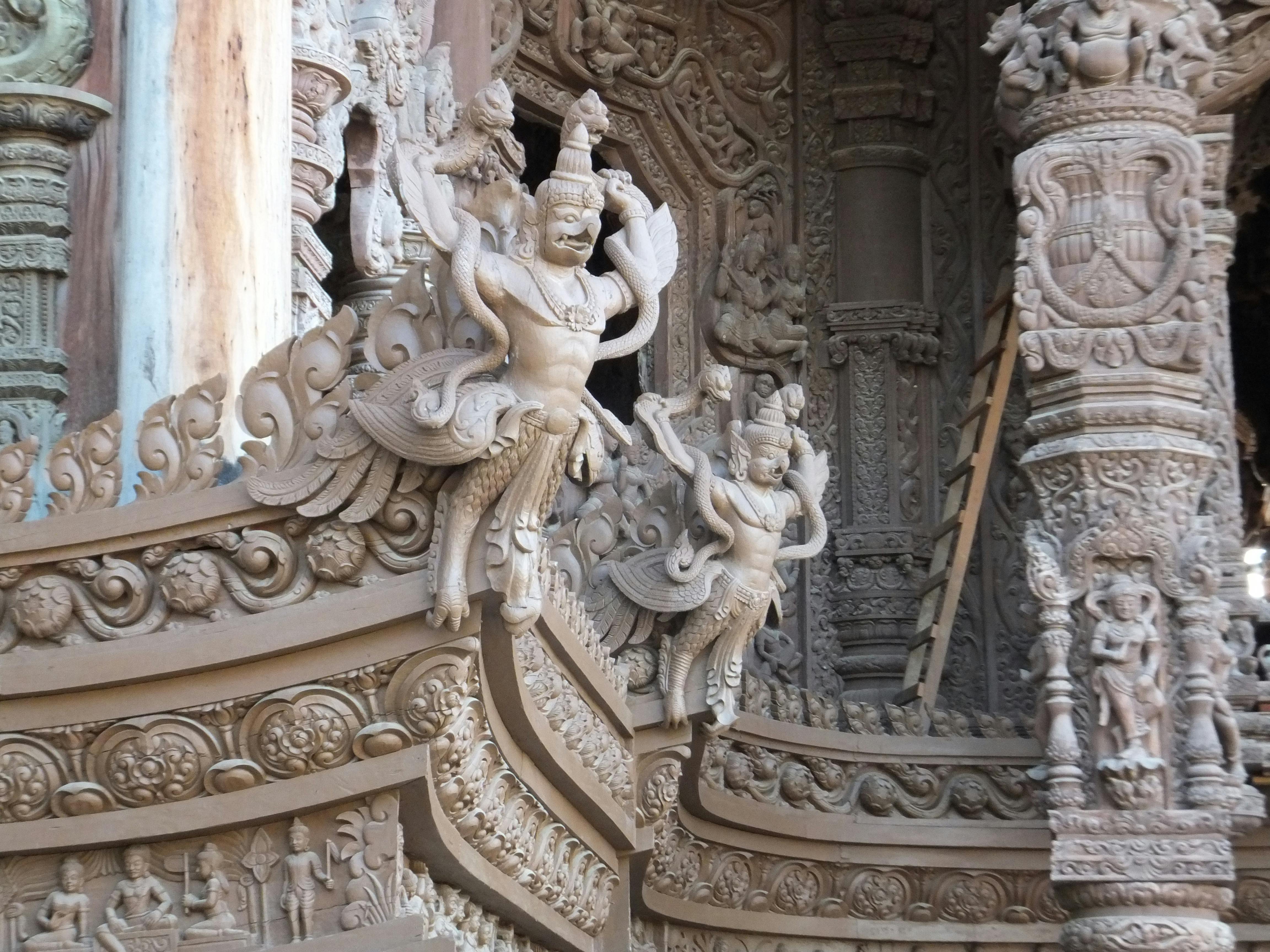 Detailed sculptures at the Sanctuary of Truth in Pattaya, Thailand, showcasing exquisite craftsmanship.