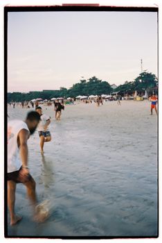 People enjoying a vibrant beach day with activities in Bali, Indonesia.