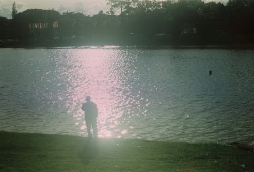 Foto d'estoc gratuïta de llum del capvespre, pescador, retroil·luminat