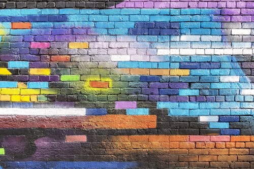 Foto profissional grátis de ladrilho, parede de ladrilhos, pintura colorida