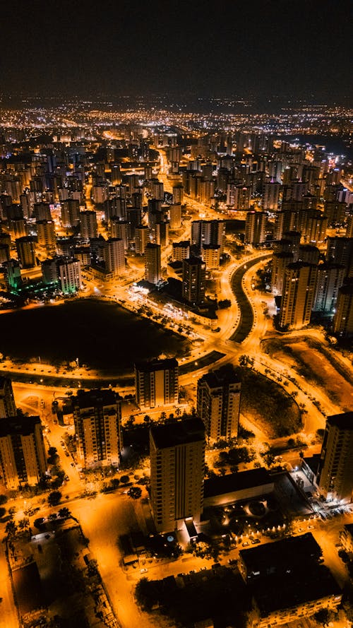 A city at night with lights and buildings