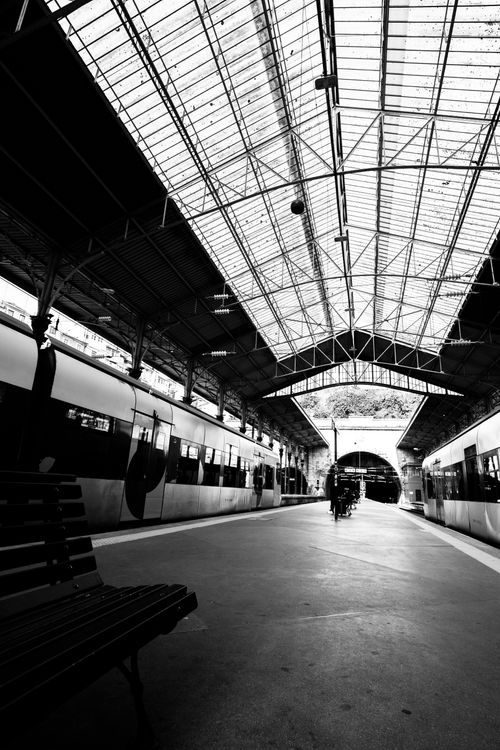 Free Black and white view of a dramatic Porto train station archway and platform. Stock Photo