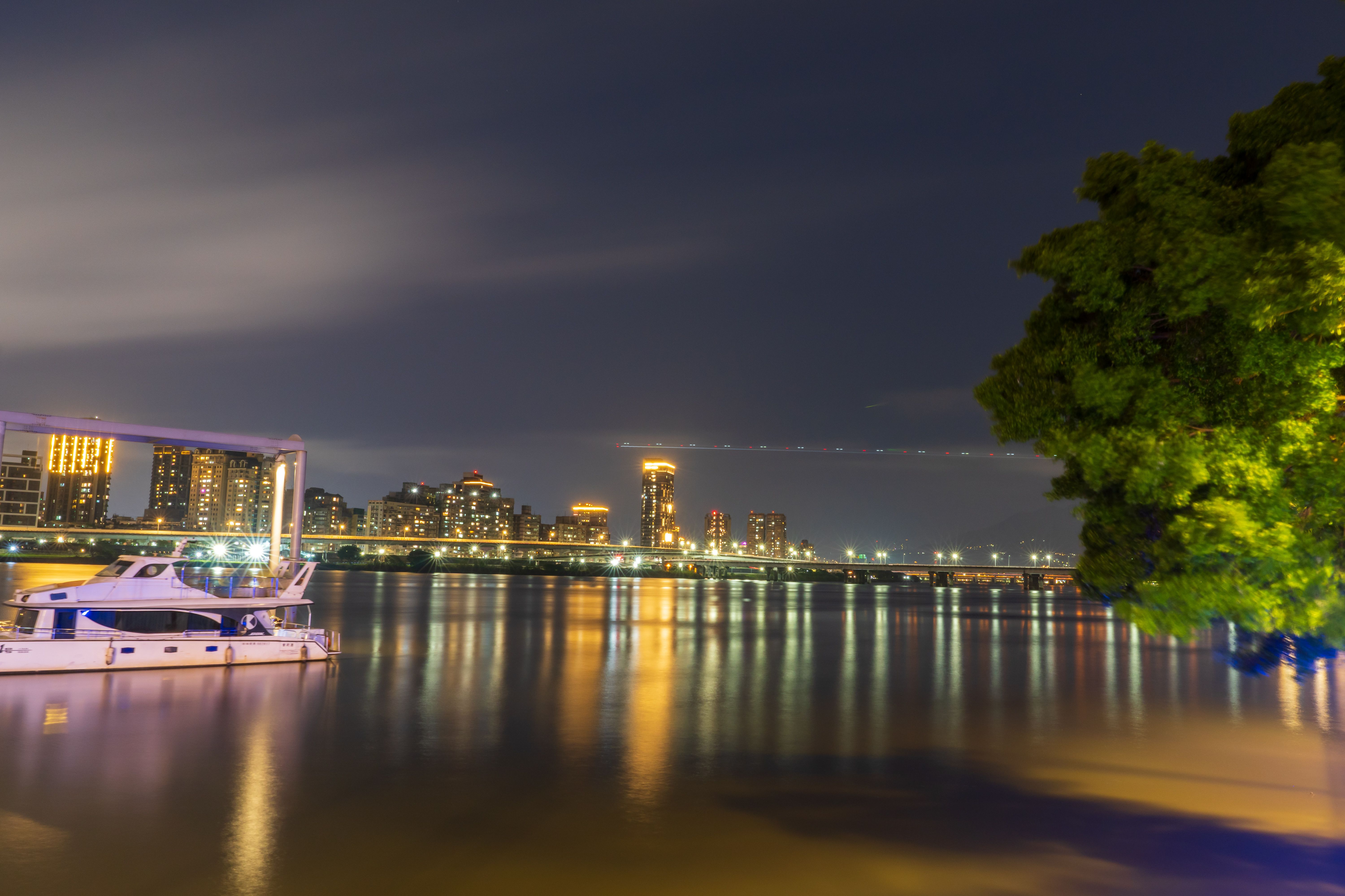 River and Illuminated City at Night · Free Stock Photo