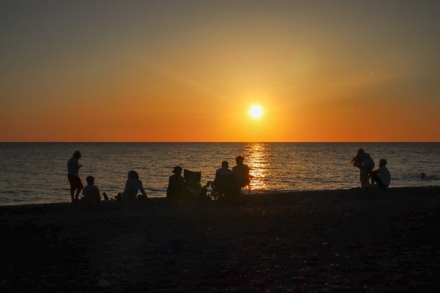The Cove gathers on the beach for the July bonfire — photo by Erhan Üstünbaş on Pexels