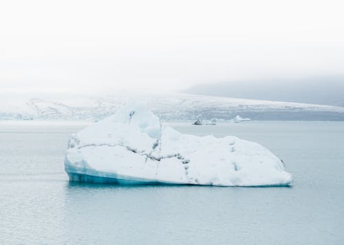 Iceberg Drifting On Icy Water