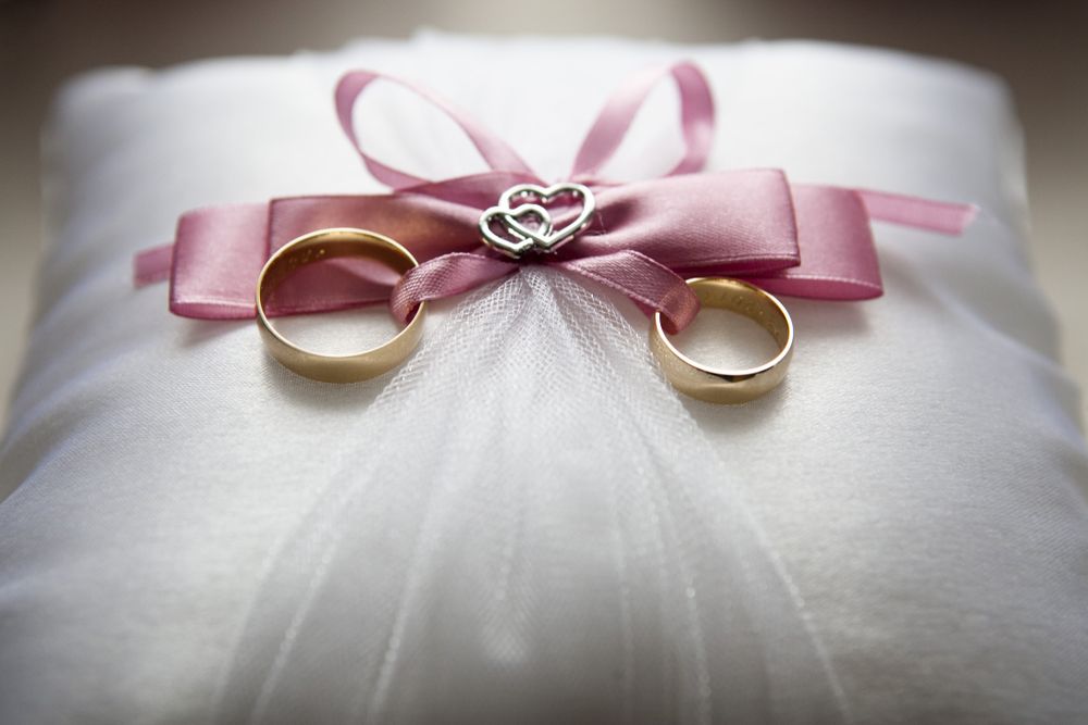 Wedding rings on a decorated pillow