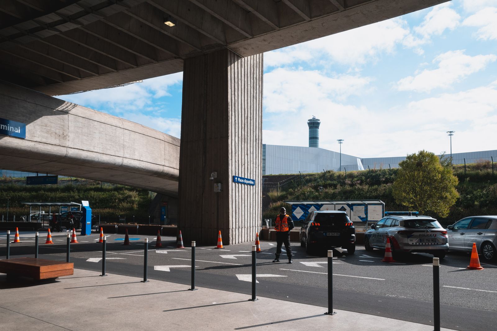 Row of taxis waiting outside an airport arrivals terminal