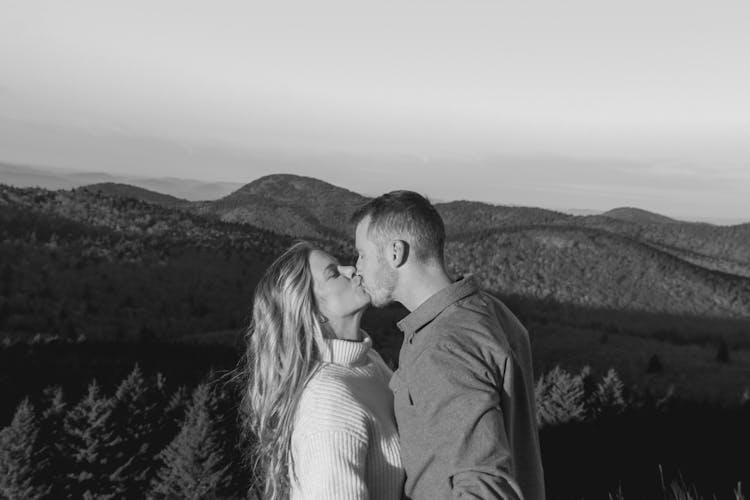 Woman And Man Kissing In Black And White