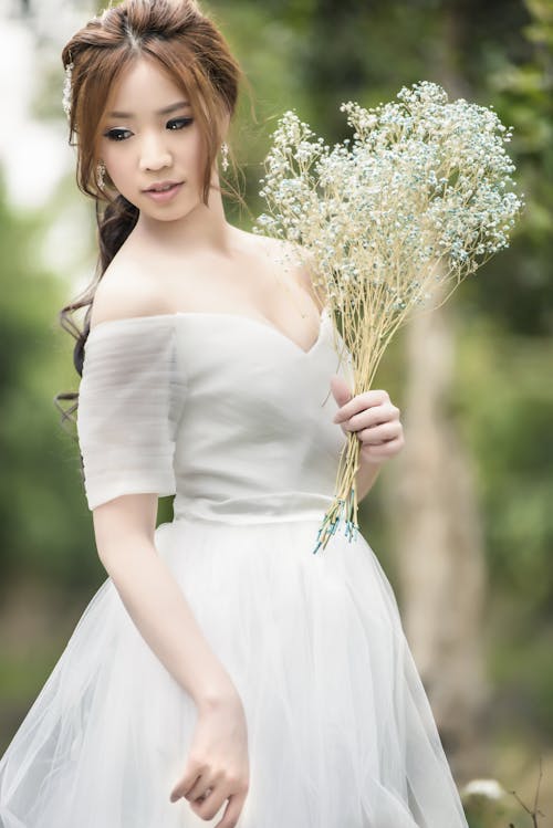 Bride Holding White Baby's Breath Flower Bouquet