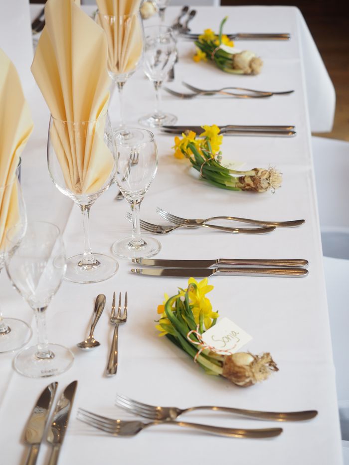 Wedding reception table with floral settings and elegant glassware