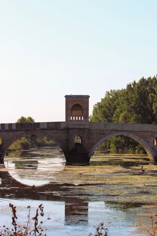Free Scenic view of Tunca Bridge spanning the Tundzha River in Edirne, Turkey, surrounded by nature. Stock Photo