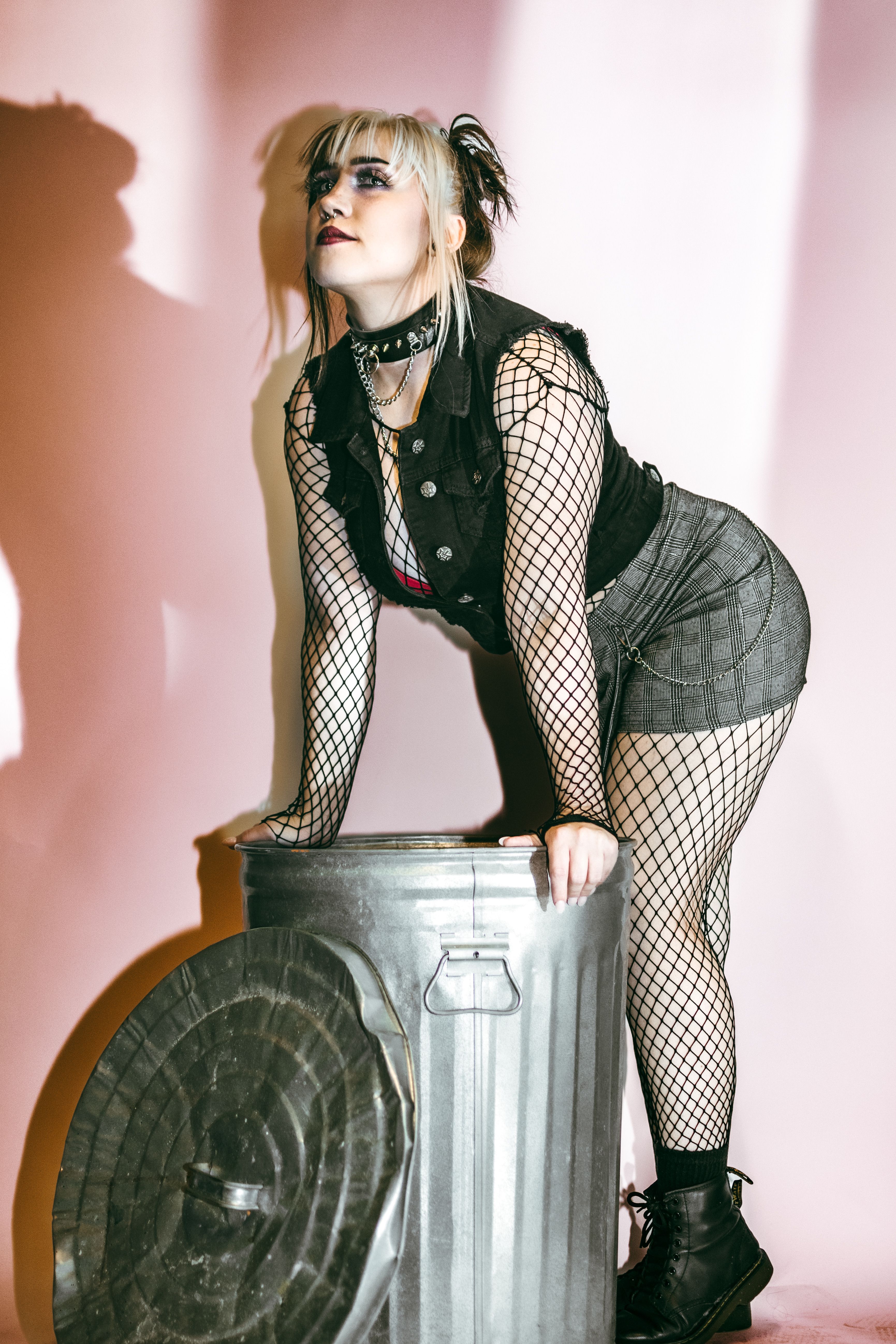 Stylish punk attire against a rustic background in Lakeland, FL.