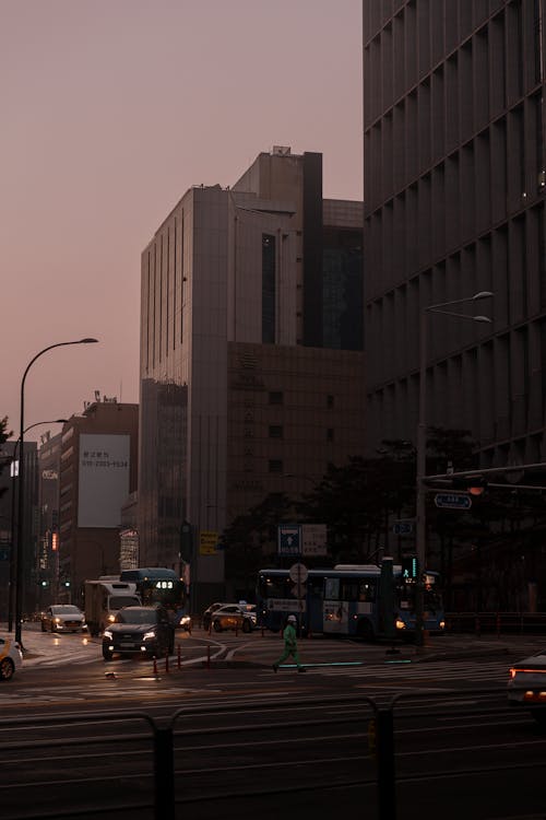 A city street with a bus and a car