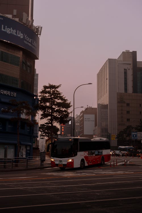 A bus driving down a street in a city