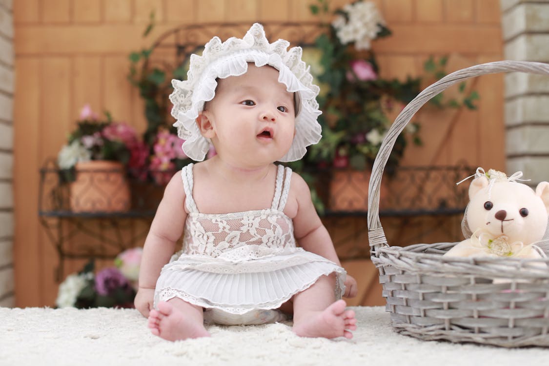 Baby Sitting Beside Woven Basket