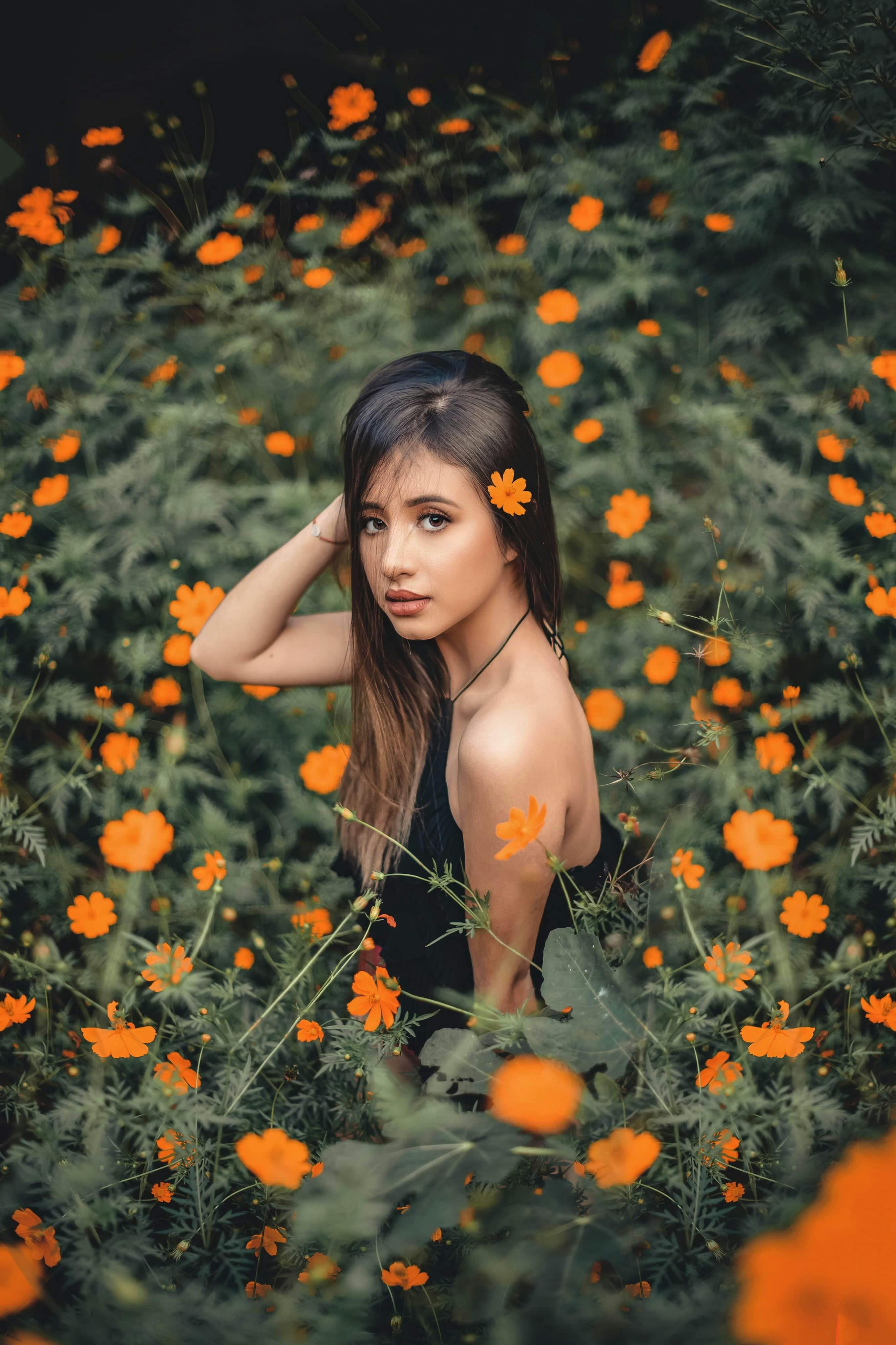 Woman in Orange Flower Field