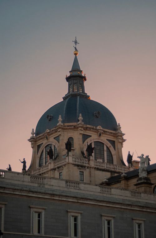 Free A stunning view of a cathedral dome against a twilight sky, featuring classic architecture and religious significance. Stock Photo