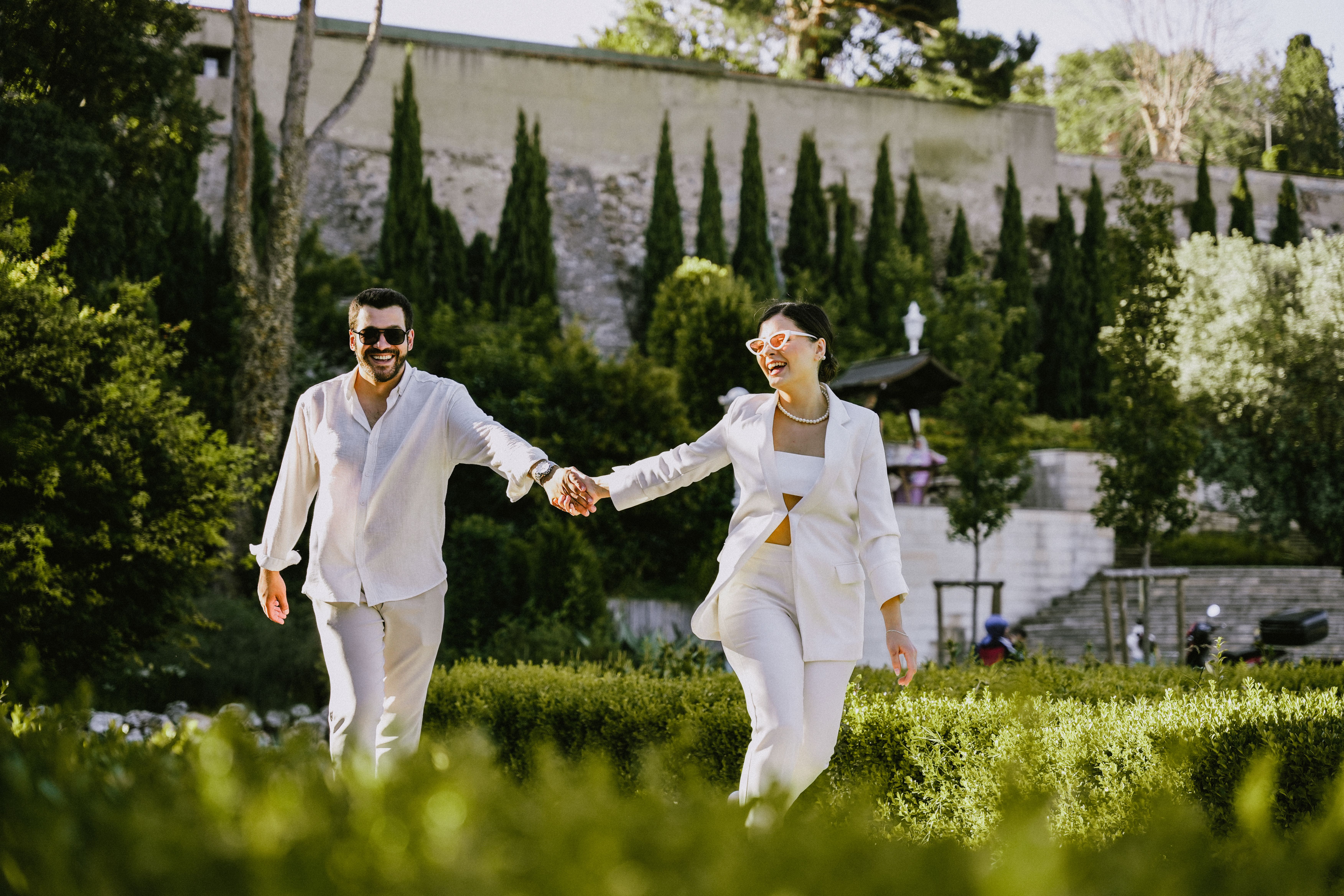 Smiling Couple Holding Hands at Park · Free Stock Photo