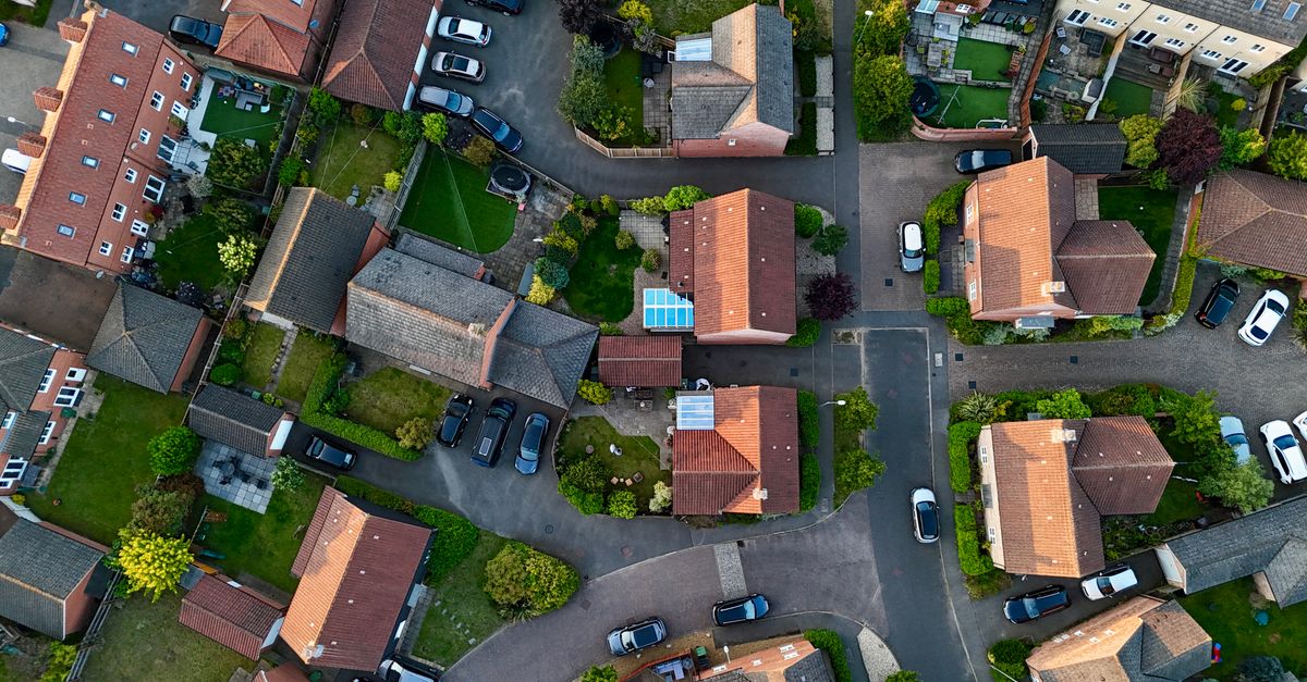 Aerial photograph showcasing residential houses and streets in Norwich, UK.