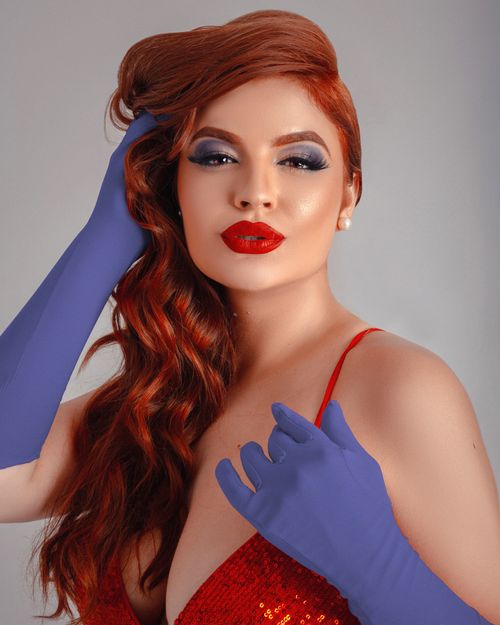 red hair red dress purple gloves ChloeBailey opted for sultry dressing as 'Jessica Rabbit' from Who Framed  Roger Rabbit. She donned Donning a ginger wig, purple gloves and a  bedazzled red dress. : @chloebailey #BellaNaijaStyle #HalloweenCostume  #ChloeBailey #CelebrityFashion