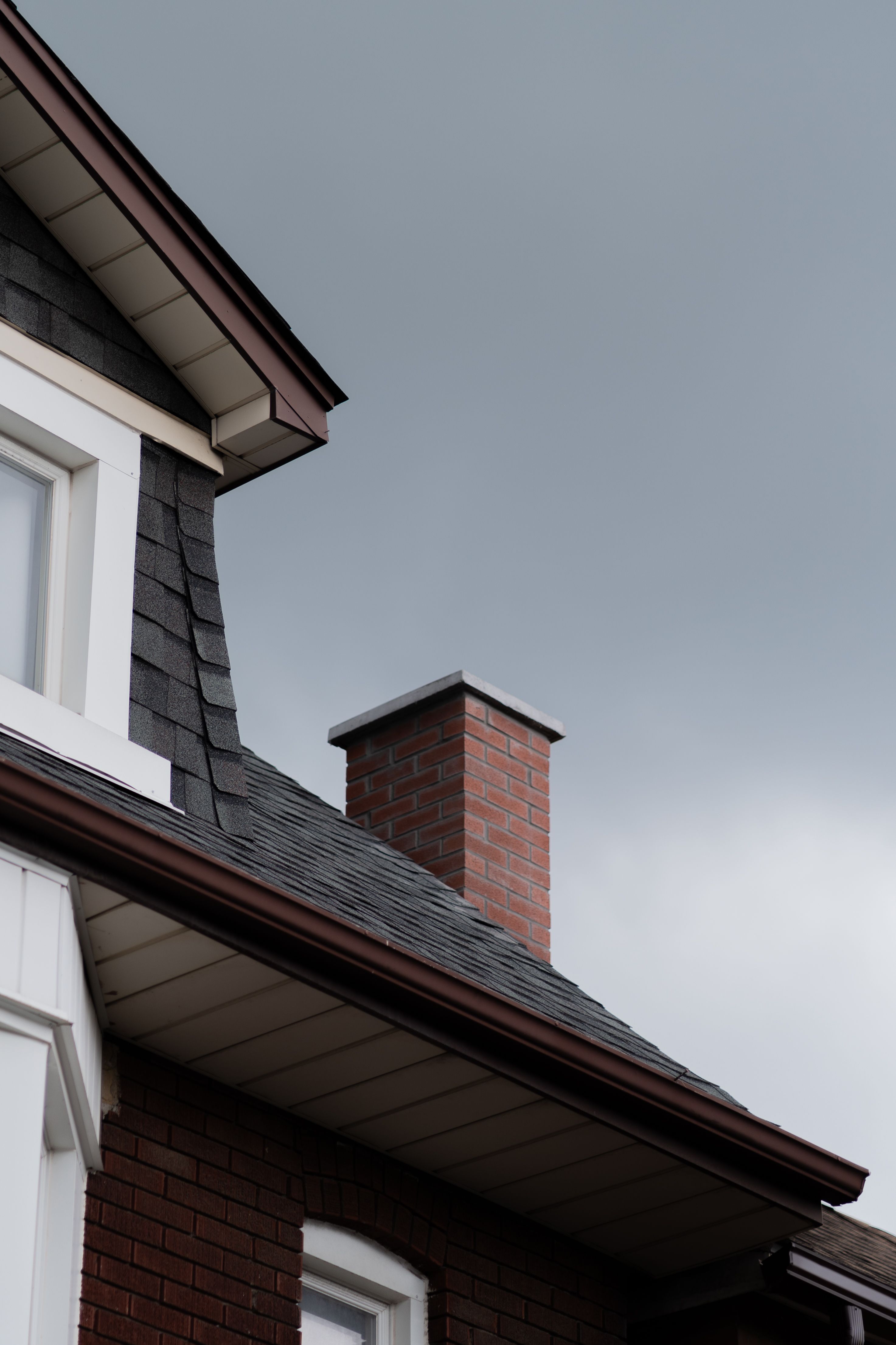 House roof with brick chimney
