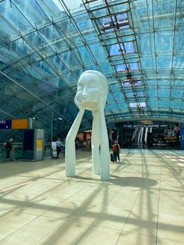 Intriguing sculpture inside Frankfurt airport, showcasing contemporary art in a bustling travel hub.