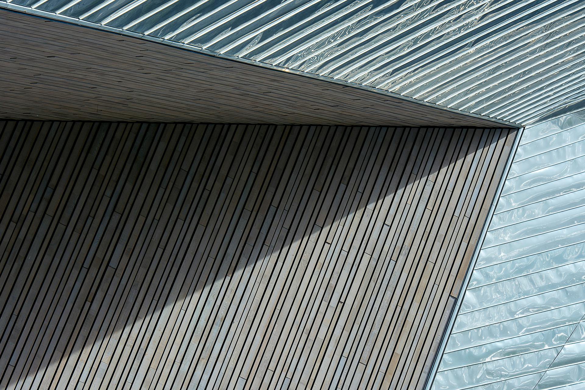 Abstract view of modern architecture in Rotterdam with wood and metal textures.