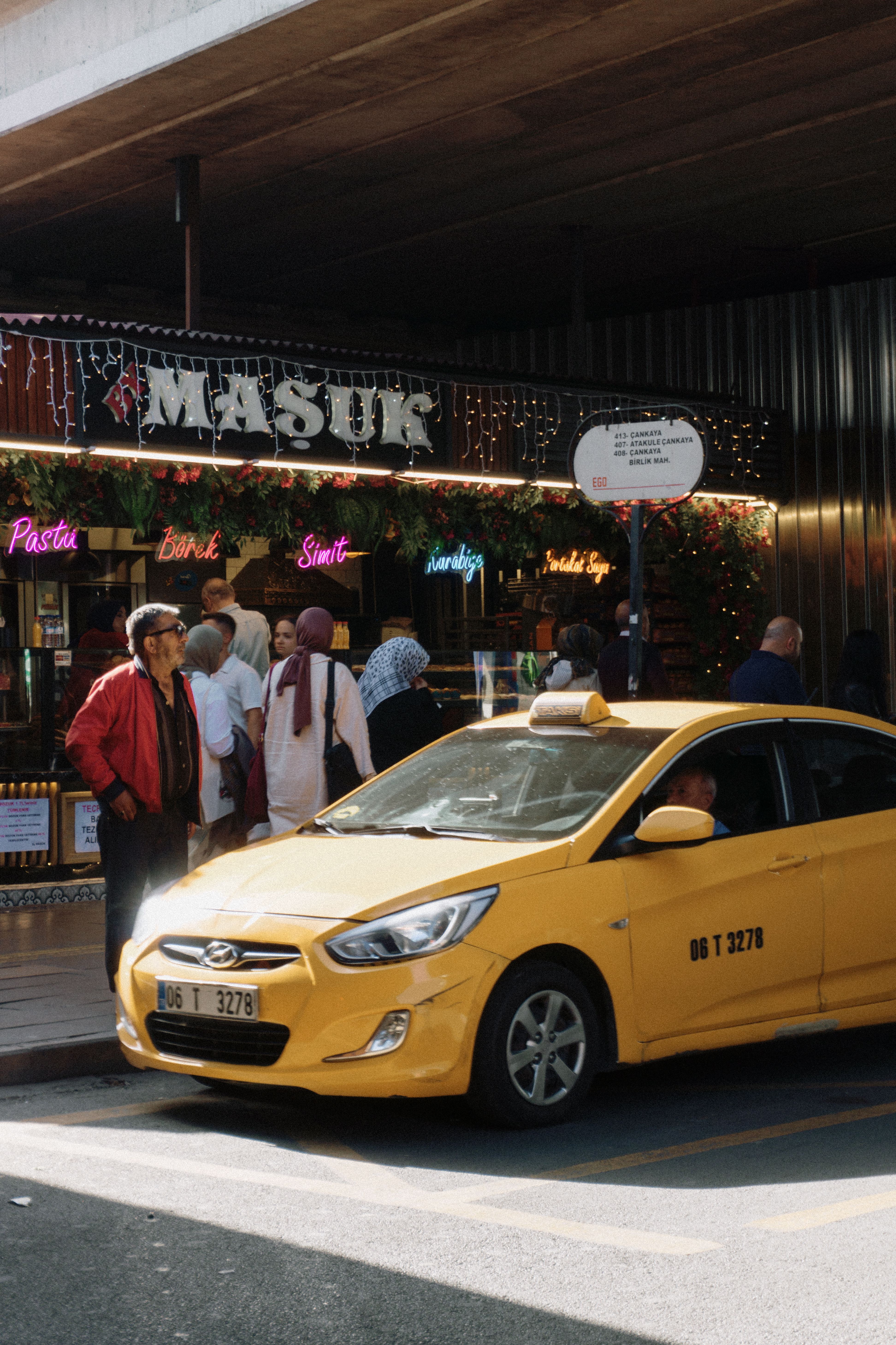 A Taxi on the Street and Pedestrians Walking on the Sidewalk · Free ...