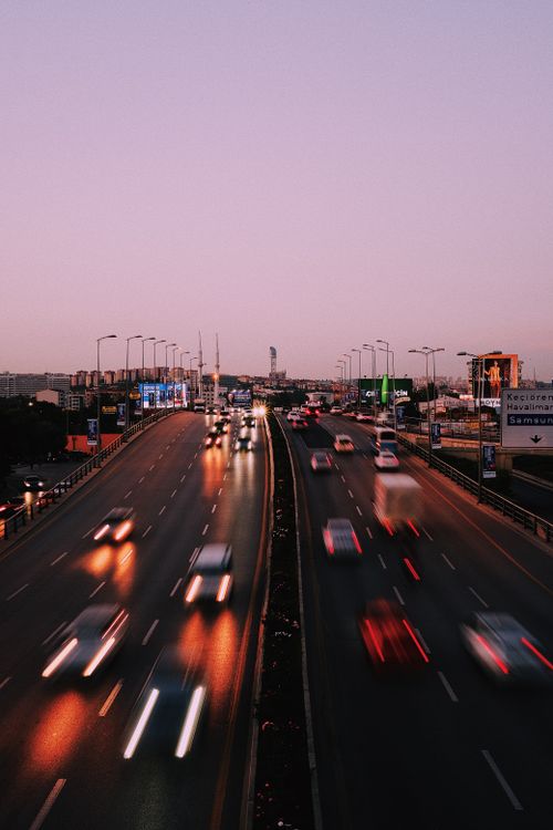 Free Aerial view of busy highway in Ankara, Türkiye, with blurred motion of cars at dusk. Stock Photo